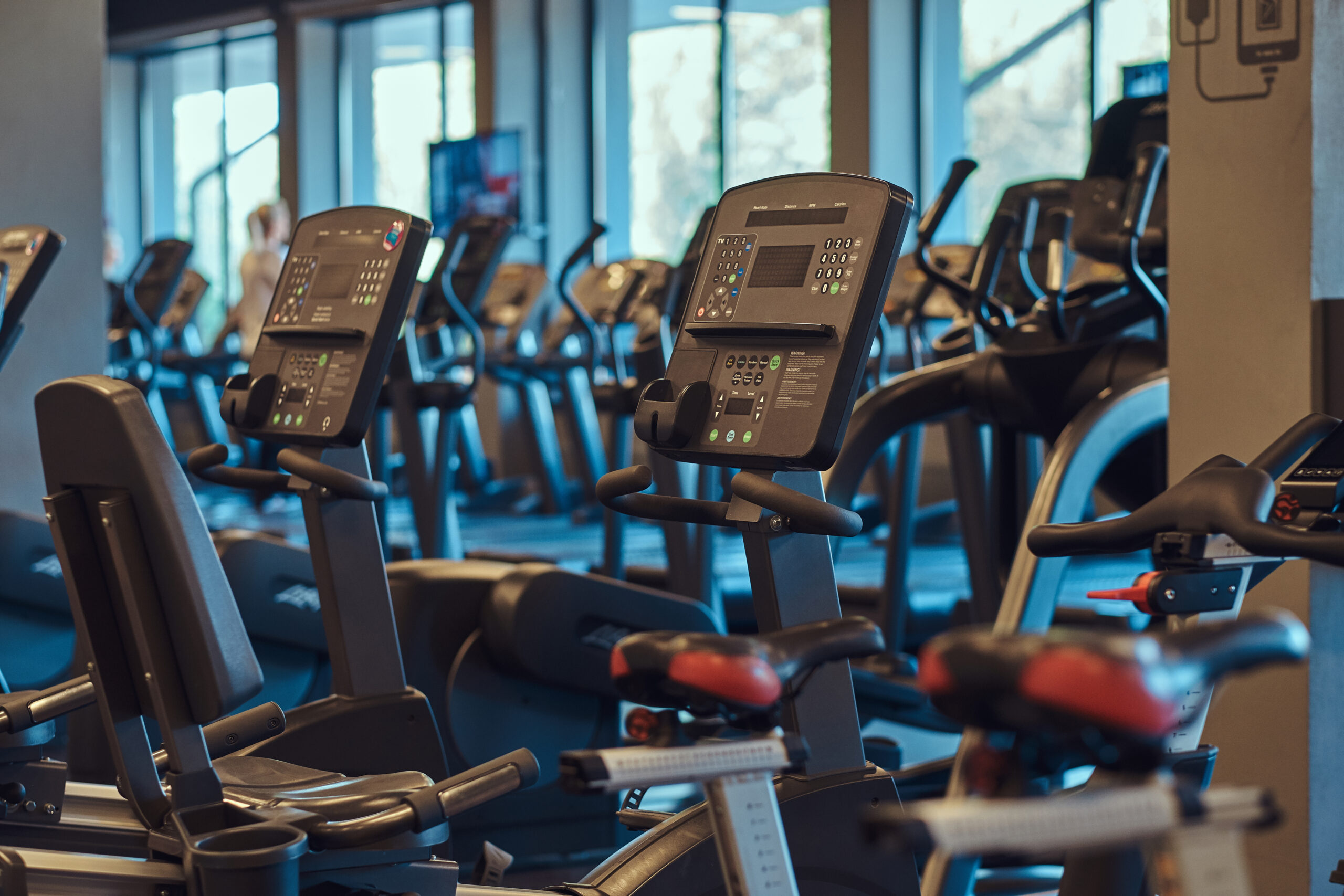 Interior of fitness hall with fitness bicycles.
